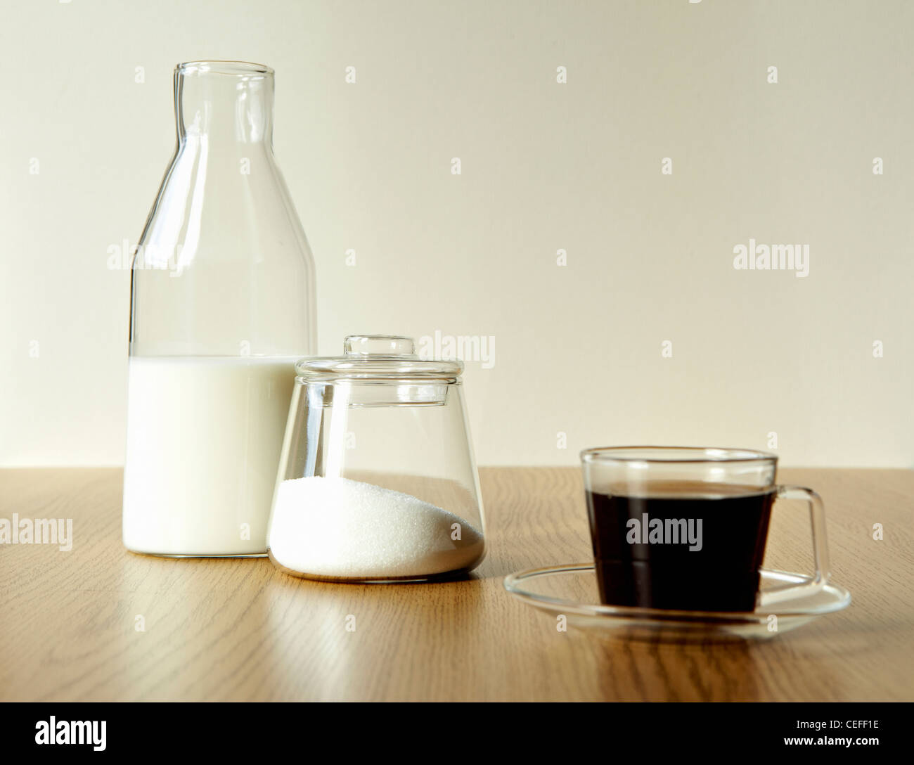 Milk and sugar with cup of tea Stock Photo