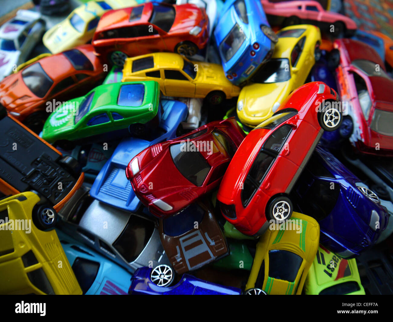 lots of toy cars in a pile Stock Photo