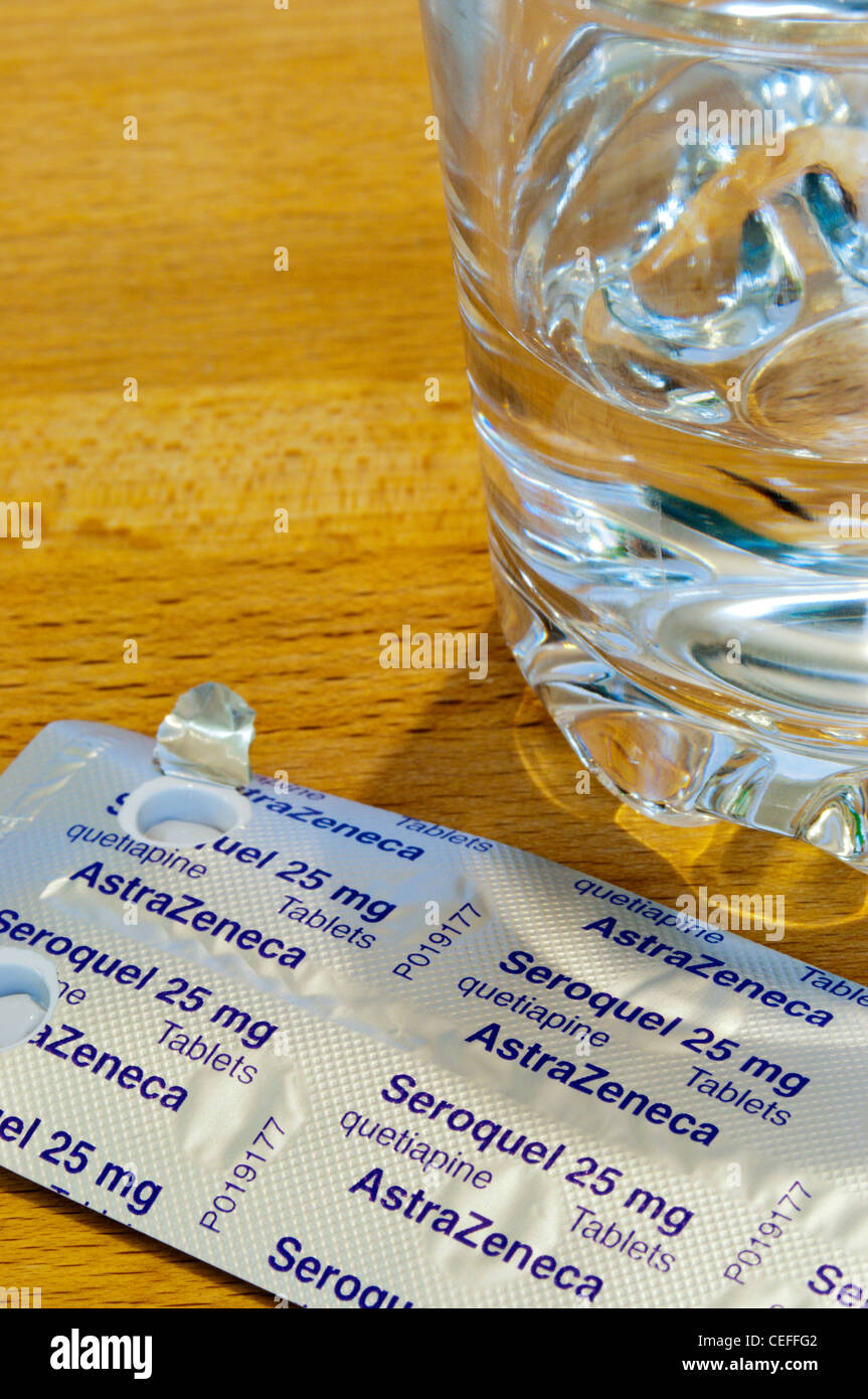 A pack of Seroquel tablets on a bedside table, used as treatment for schizophrenia or bipolar disorder. Stock Photo