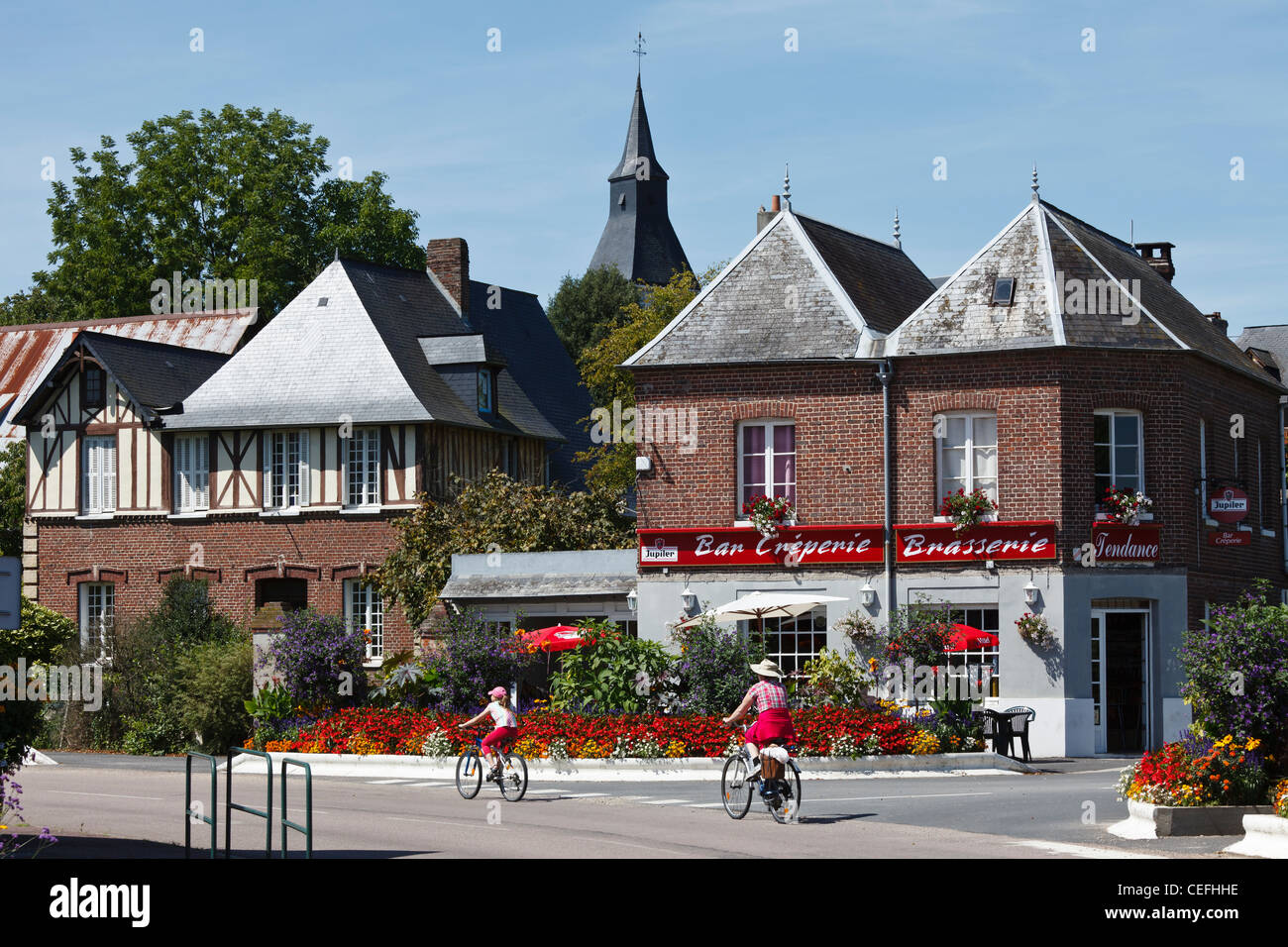 Cycling through the village of Le Mesnil sous Jumièges, Normandy, France Stock Photo