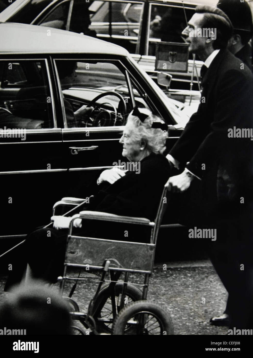 Lady Clementine Churchill is wheeled away from a memorial service for Anthony Eden Stock Photo