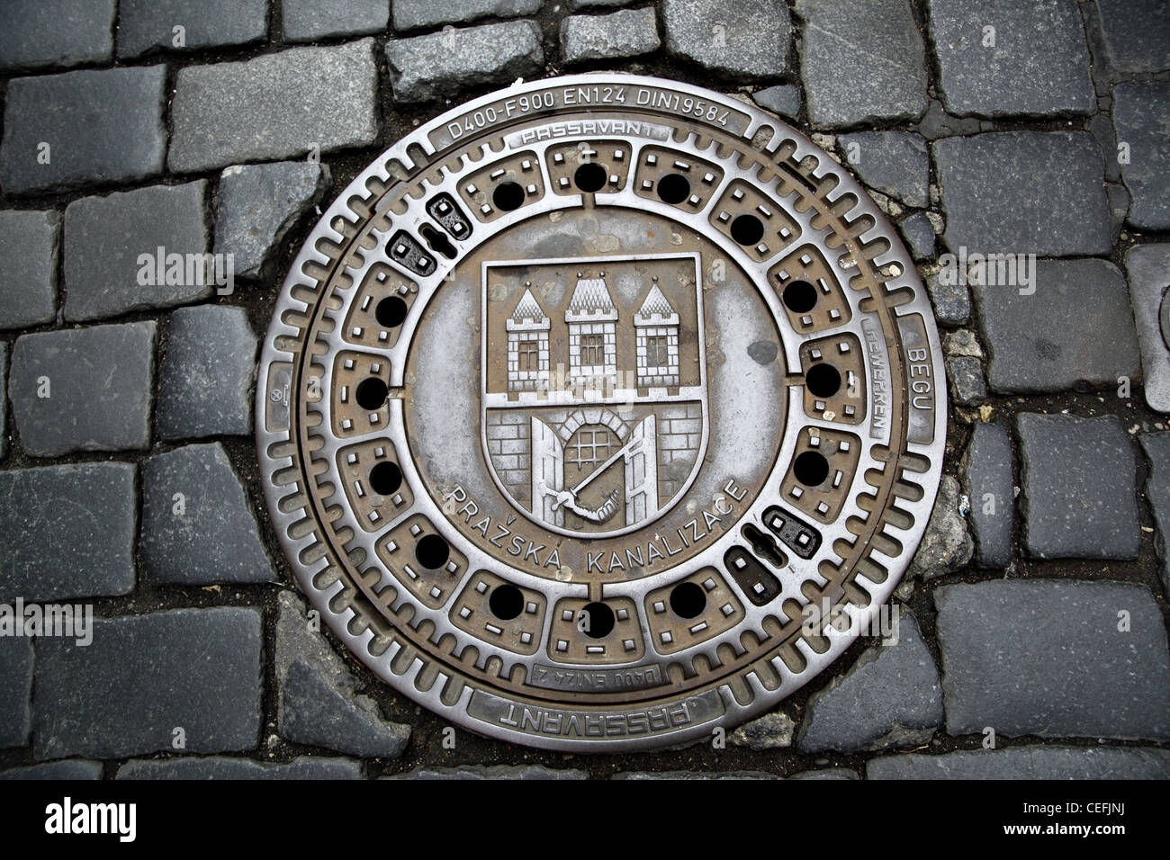 Man hole cover in Prague, Czech republic Stock Photo
