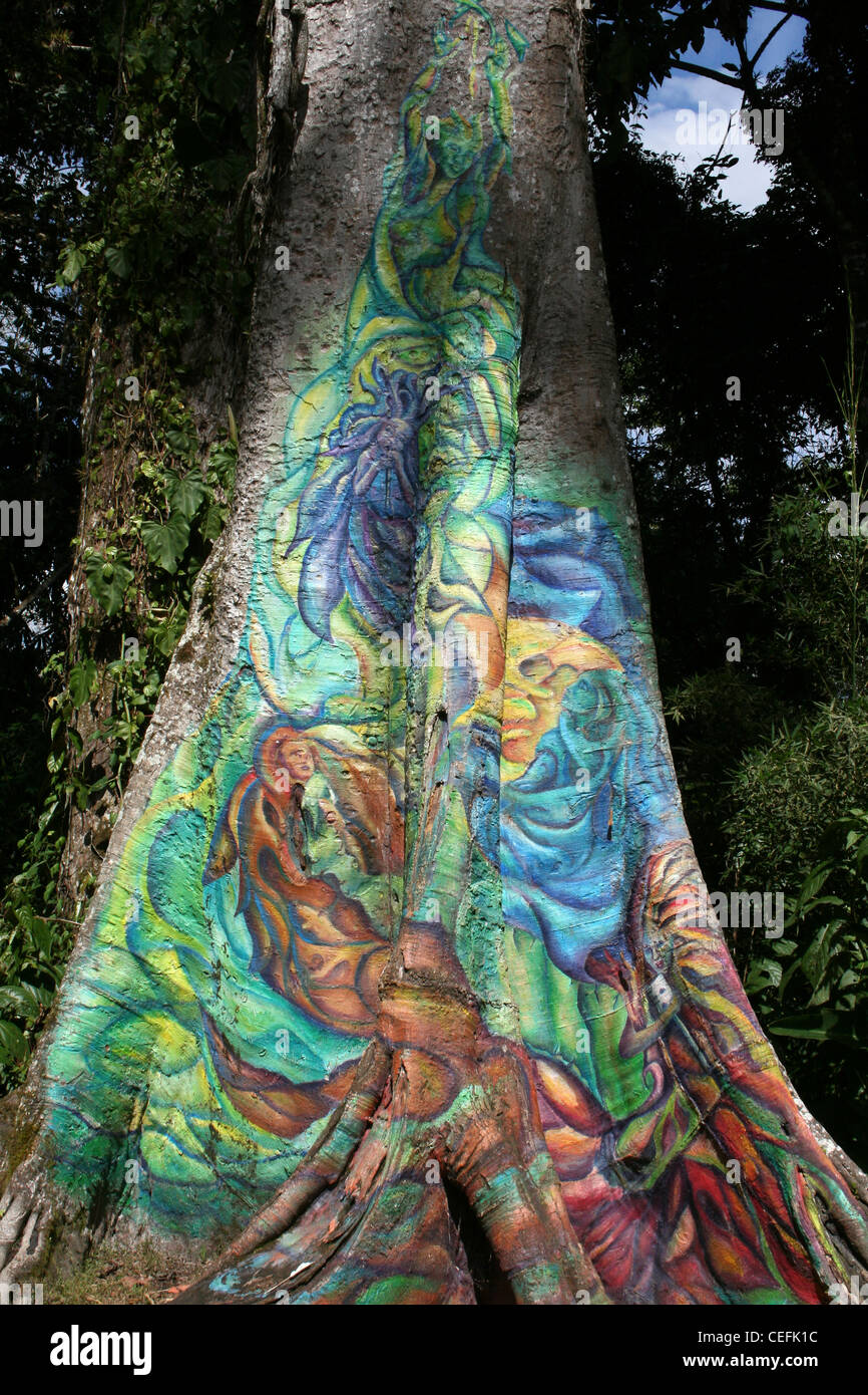 Colourful Painting Of Wood Fairies On a Tree Trunk In CATIE, Costa Rica Stock Photo