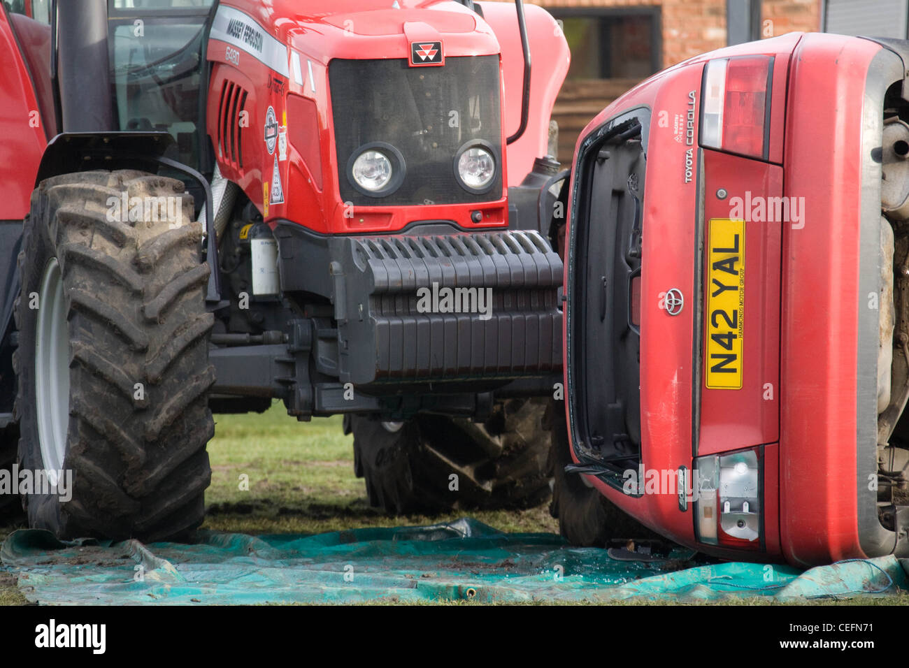 Car involved in a road traffic accident with a farm tractor. ***NOTE TO EDITORS THIS IS A STAGED IMAGE*** Stock Photo