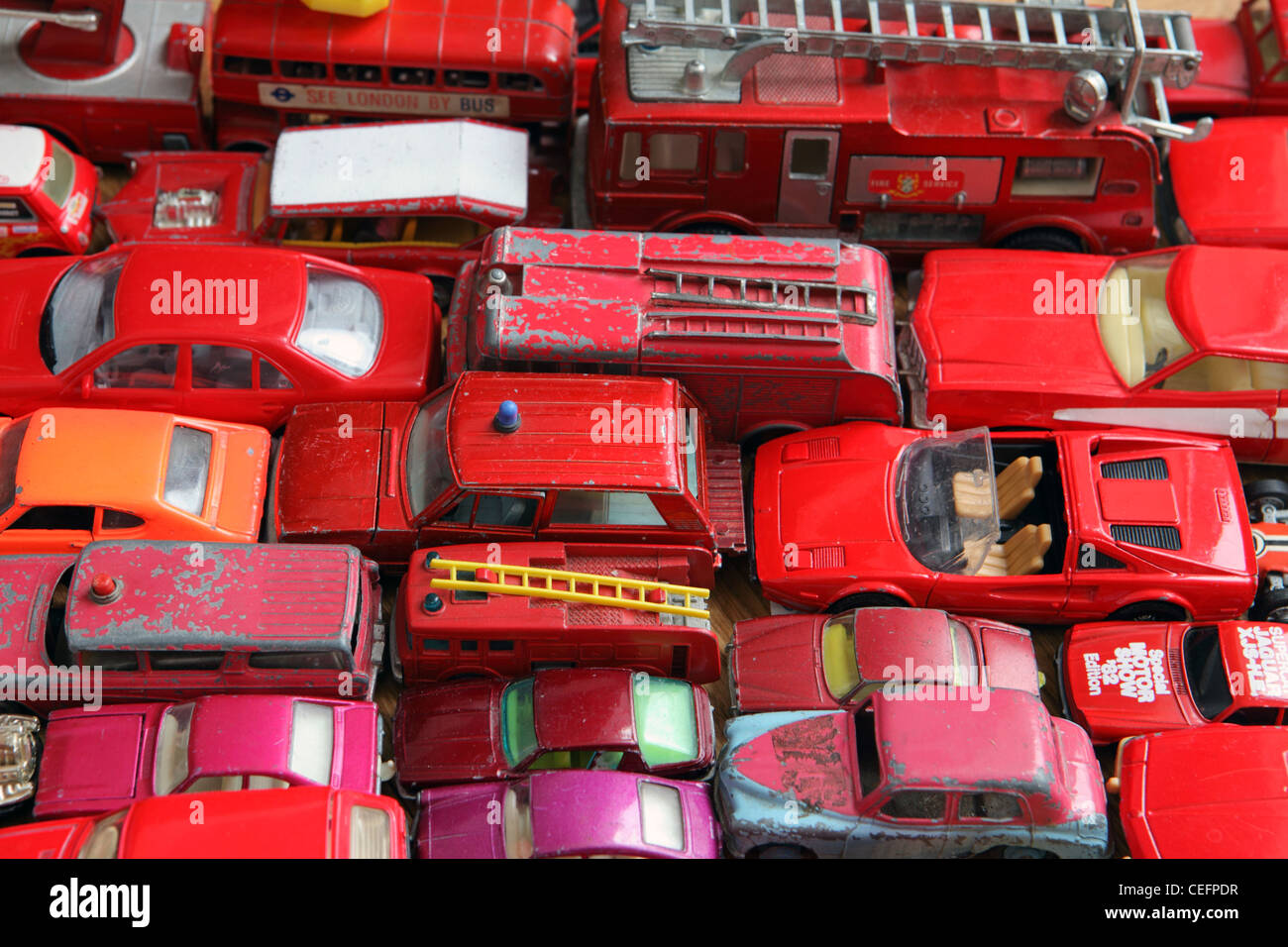 traffic jam of red model cars, all different shades of red, home studio, UK Stock Photo
