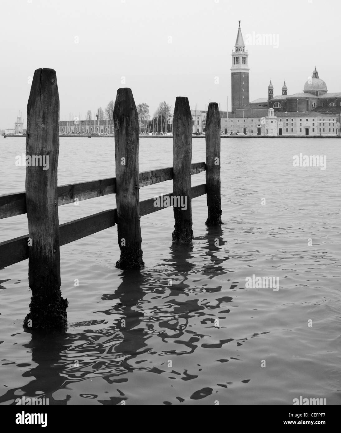 Mooring posts with the church of San Giorgio Maggiore behind. Venice, Italy. Stock Photo