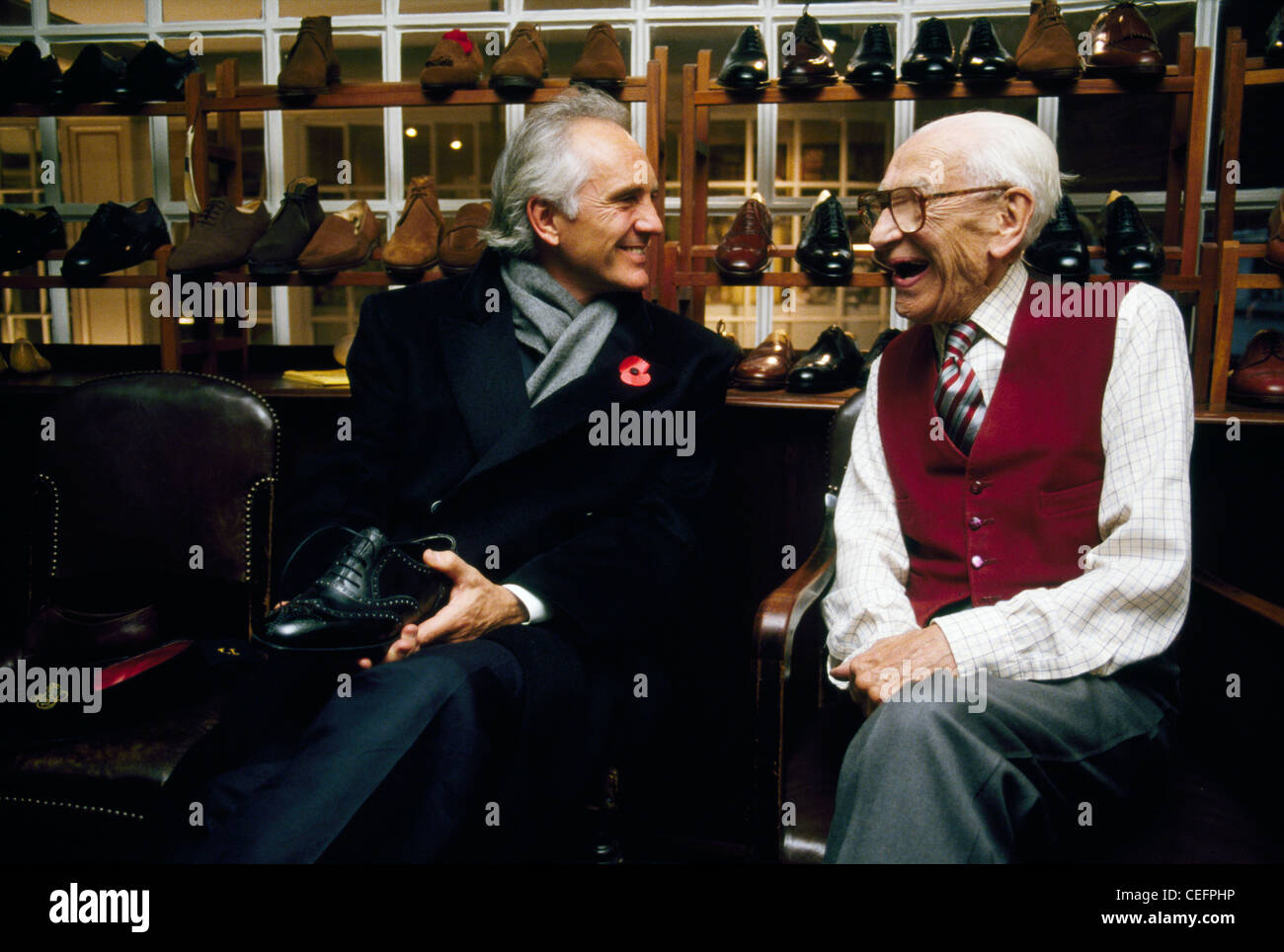 Terence Stamp with master bespoke shoemaker George Cleverley, in Cleverleys London shop Stock Photo