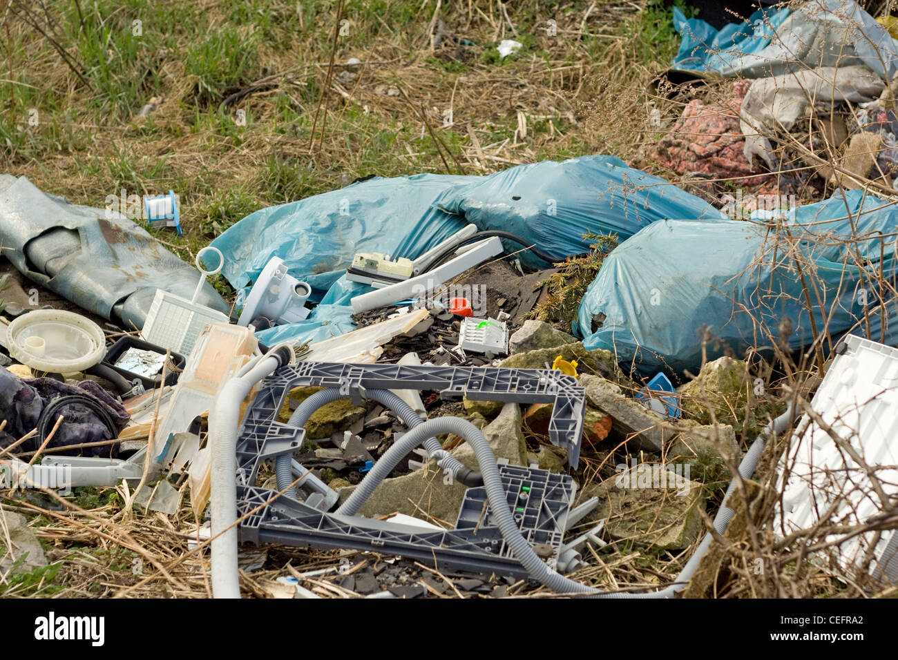 wild refuse heap left near the road throws litter about Stock Photo Alamy