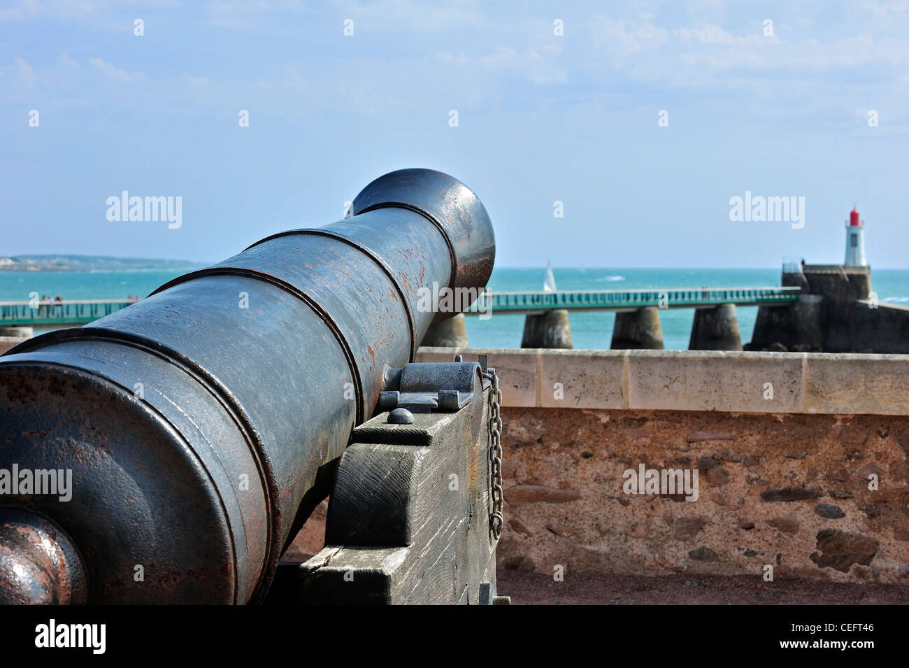 Barrel of old cannon pointing at sea near the priory Saint-Nicolas at Les Sables-d'Olonne, La Vendée, Pays de la Loire, France Stock Photo