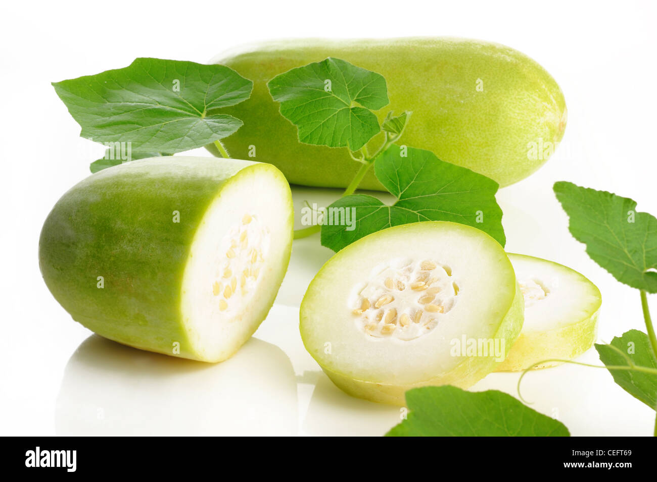 Slices of wax gourd on white background Stock Photo Alamy
