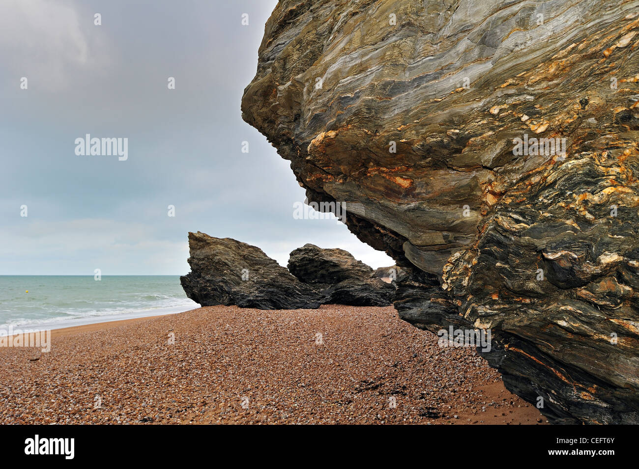 Pebble beach and eroded rocks at Saint-Hilaire-de-Riez, La Vendée, Pays de la Loire, France Stock Photo