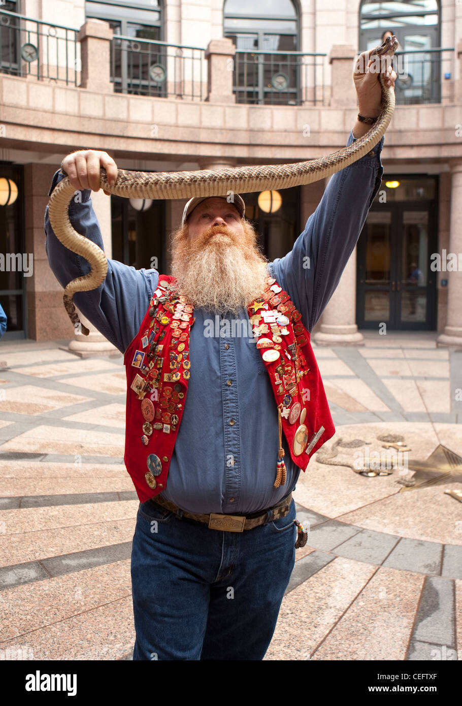 Snake handler  Riley Sawyers during a visit to the Texas Capitol to promote a rattlesnake roundup event Stock Photo