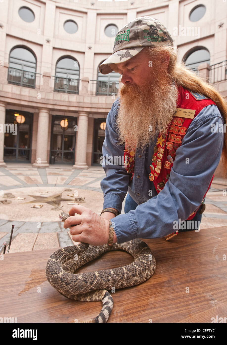 Snake handler  Riley Sawyers during a visit to the Texas Capitol to promote a rattlesnake roundup event Stock Photo