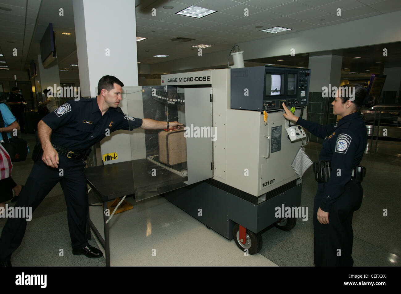 Sophisticated x-ray equipment is used to detect contraband in packages and luggage.    Sophisticated x-ray equipment is used to Stock Photo