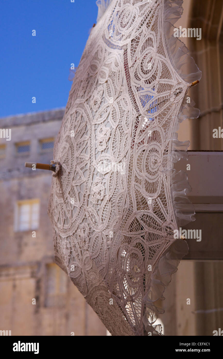 sunlight-falls-on-a-traditional-maltese-lace-umbrella-in-mdina-a-k-a