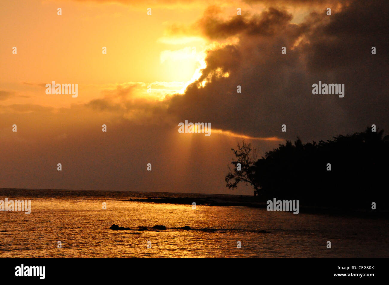 Golden sunset sub tropical sea dramatic Stock Photo