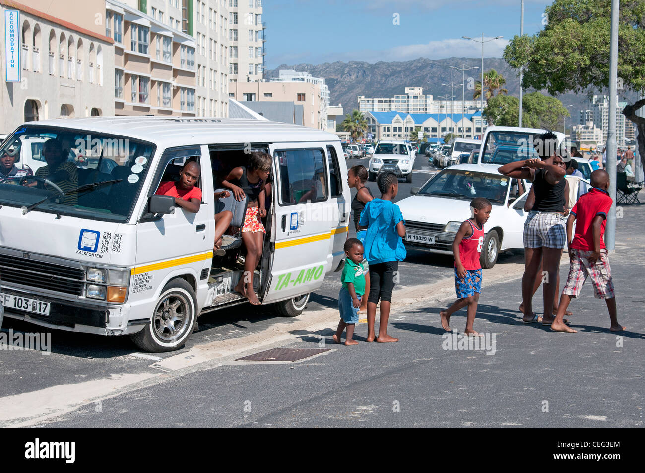 Taxi passengers arriving at the seaside town Strand Western Cape South Africa Stock Photo