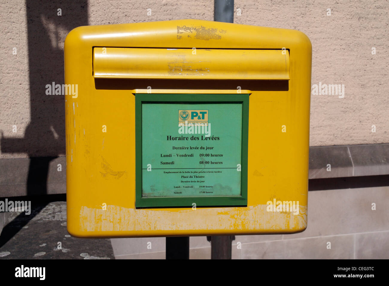 A bright yellow post box on a post in Luxembourg city, Luxembourg Stock  Photo - Alamy