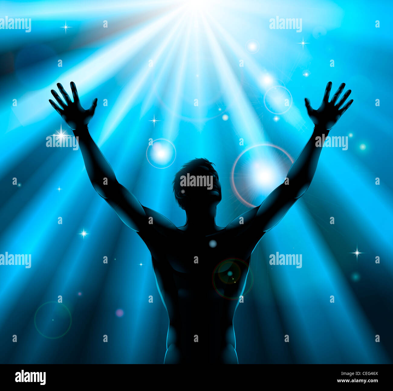 A man with hands held up in silhouette with light rays in the background Stock Photo