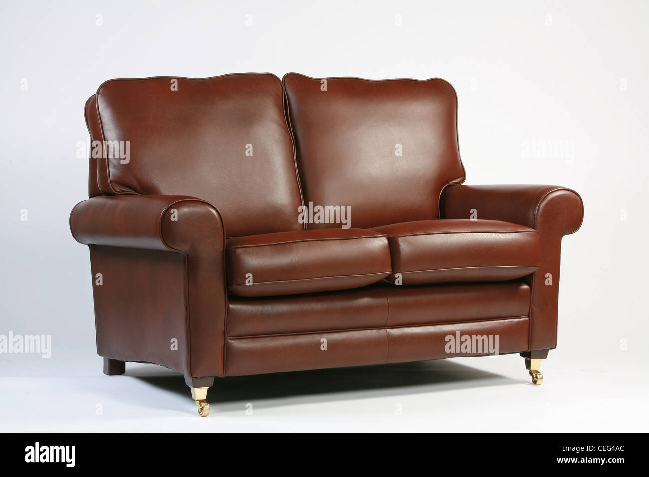 Traditional brown leather sofa on a white background Stock Photo