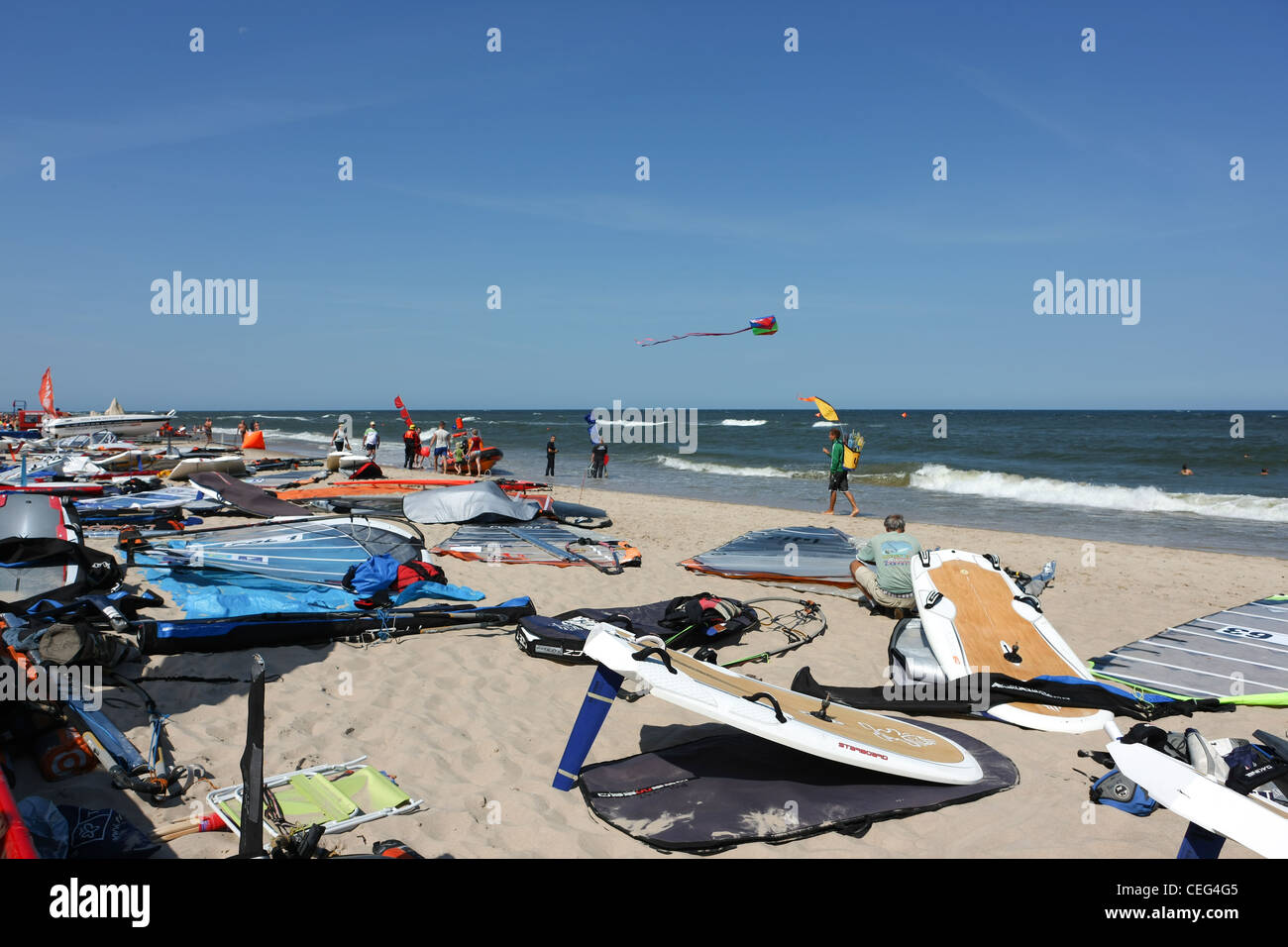 Formula Windsurfing Race . Boards are on the beach in Pobierowo, and windsurfers are preparing to take off. Stock Photo
