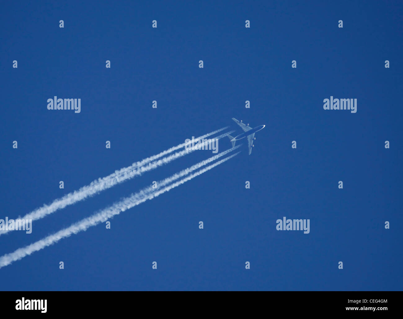 Airplane on the blue sky Stock Photo - Alamy