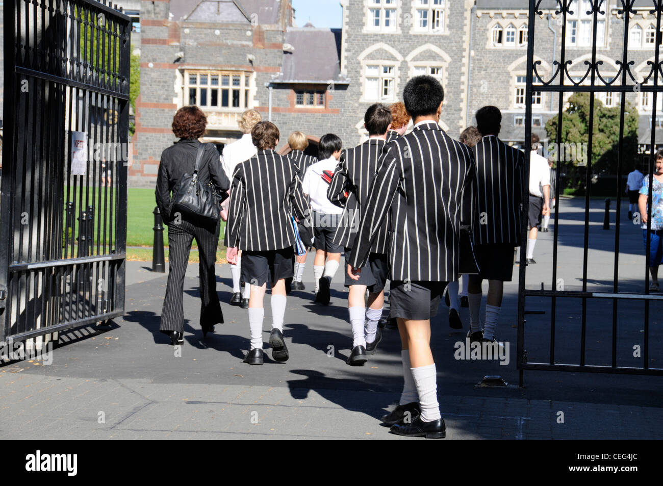 Pupils entering the main gates of the famous public school, Christ's College in Rolleston Avenue, Christchurch, New Zealand Stock Photo