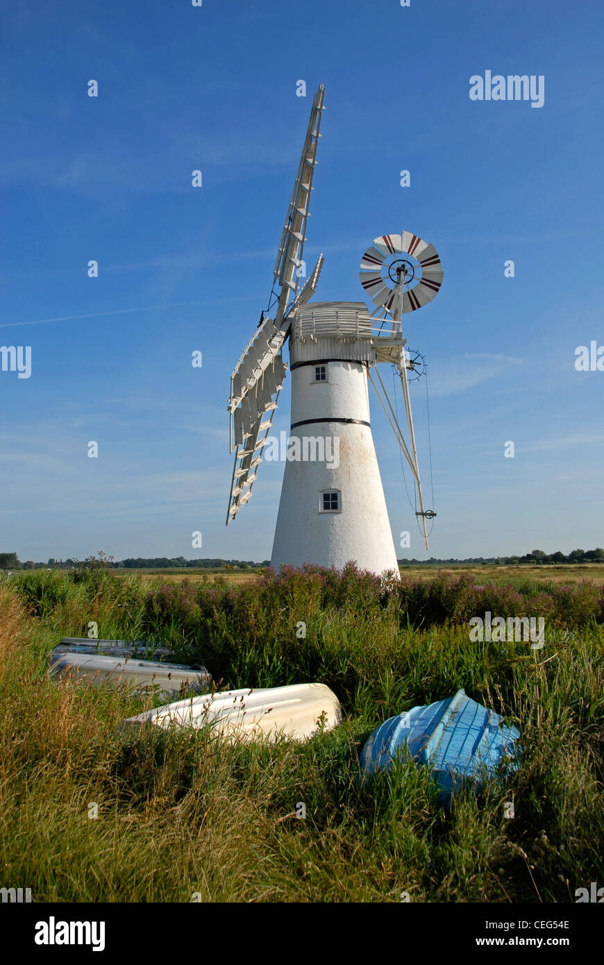 Thurne Mill, Norfolk, England, with upturned dinghies Stock Photo - Alamy