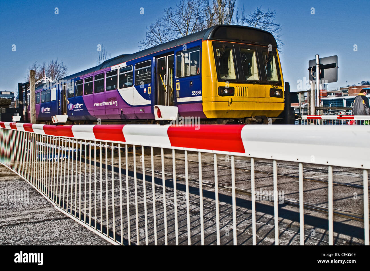 A train passing a crossing in Lincoln, UK Stock Photo