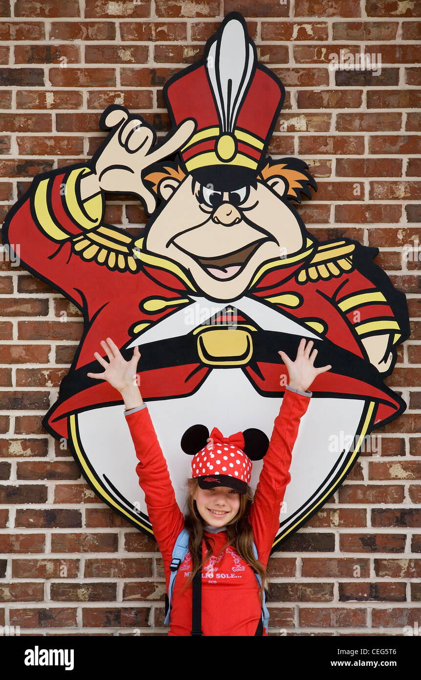 Girl with an Alice in Wonderland character, Disneyworld, Orlando, Florida, USA Stock Photo