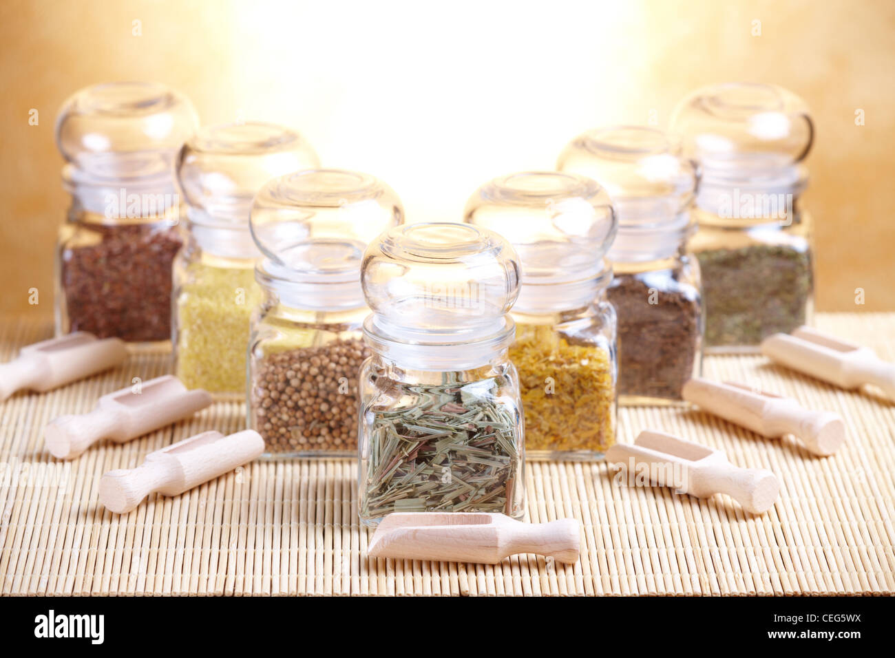 Kitchen glass jars with ingredients dried spices, herbs like savory ...