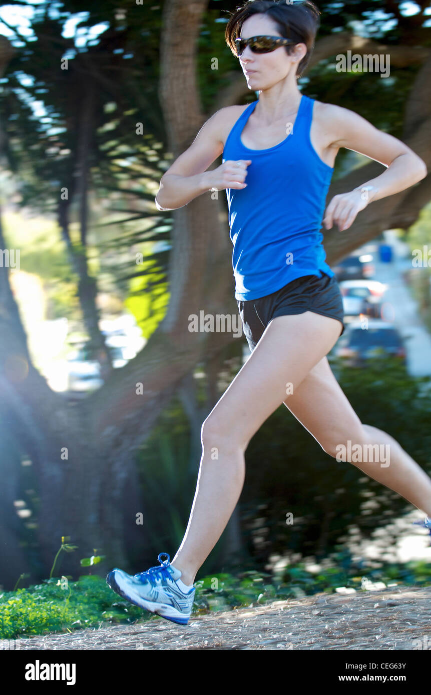 A woman running on a path. Stock Photo