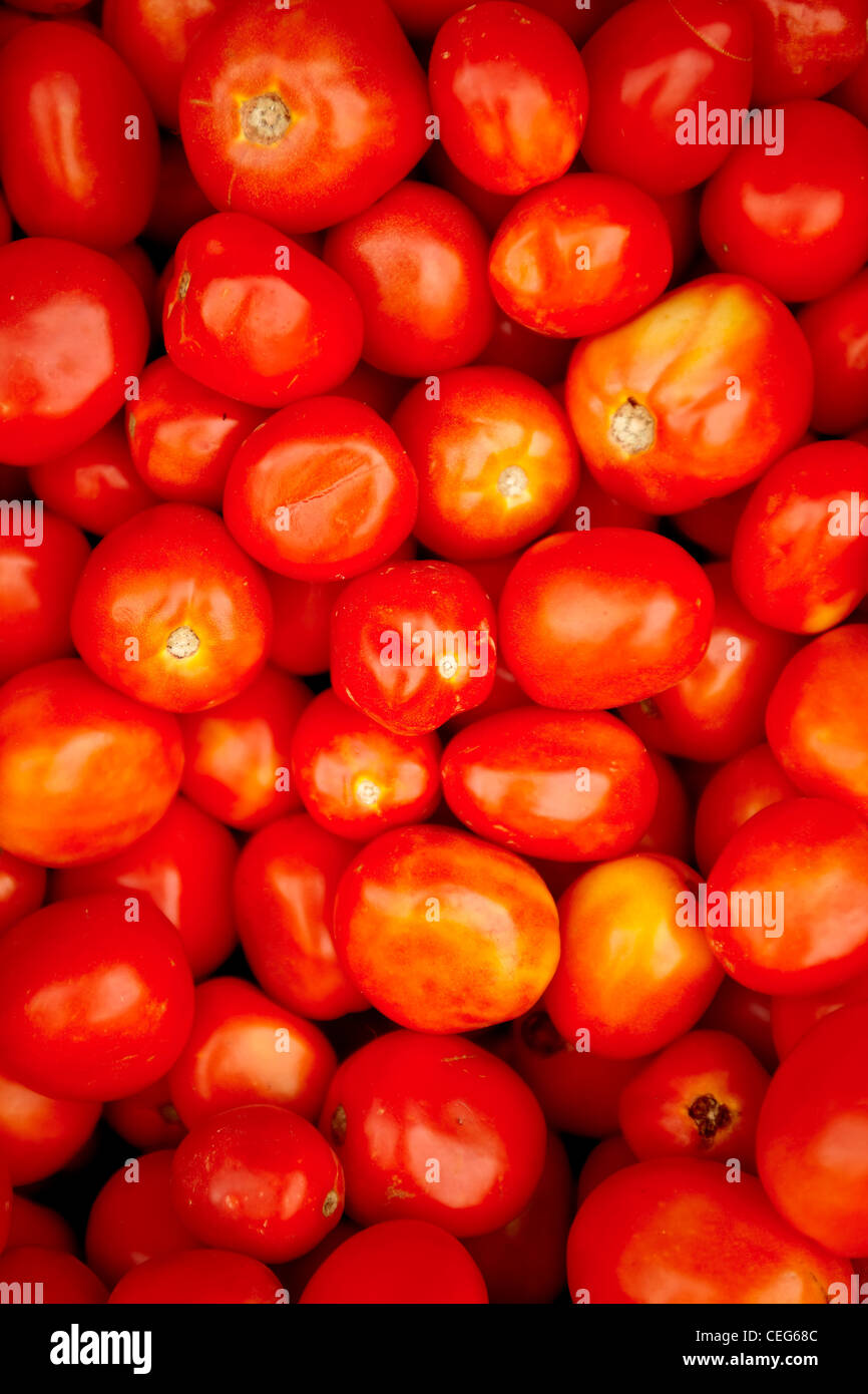 A group of tomatoes at a farmer's market Stock Photo