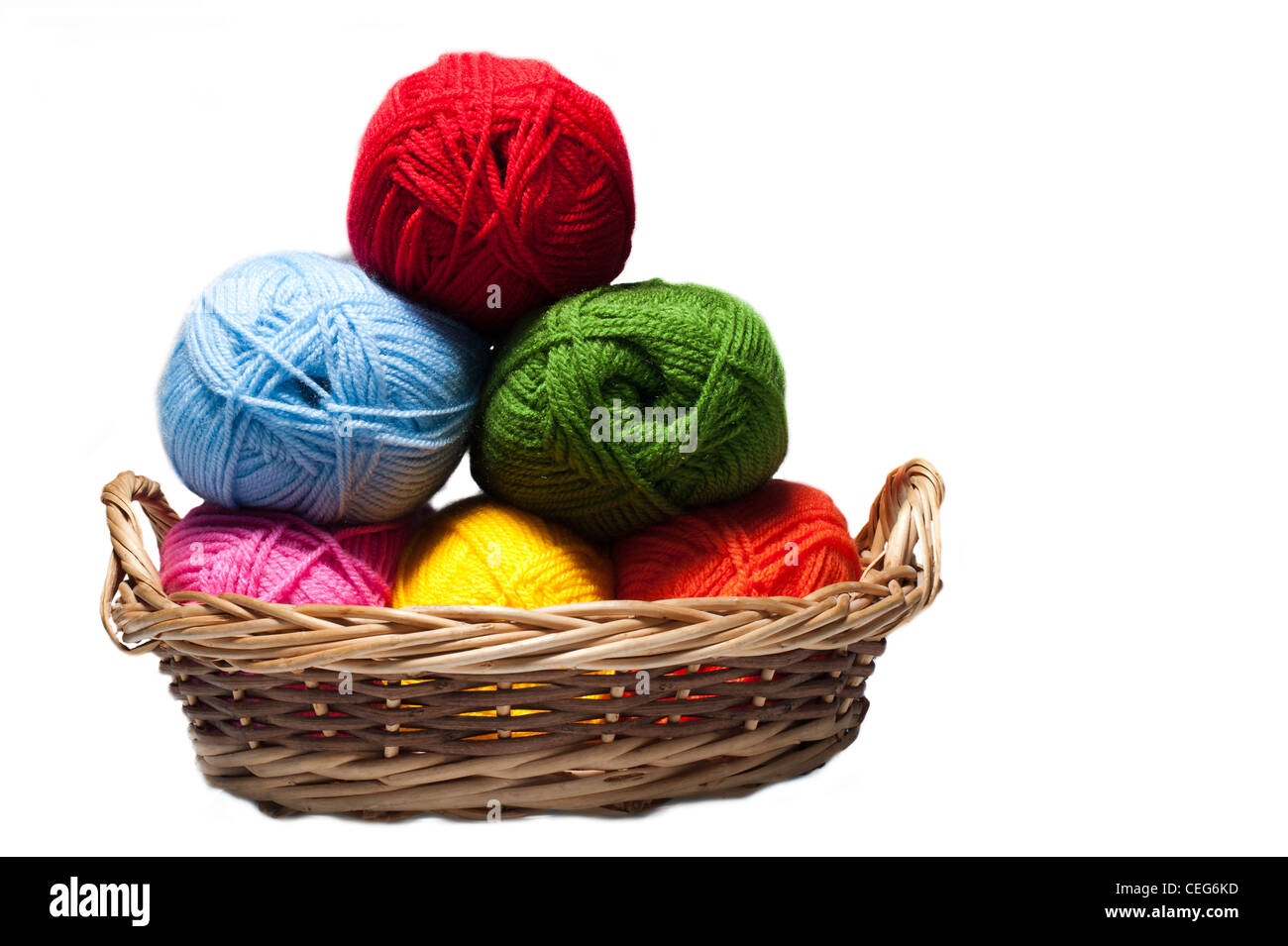 isolated colorful acrylic fibers in the basket on white background Stock Photo