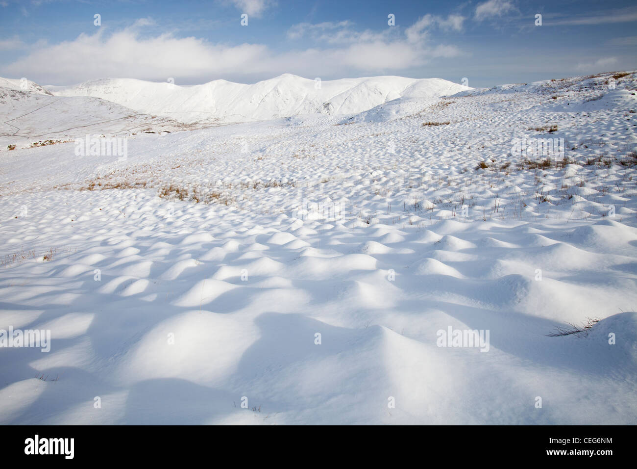 Snowy hummocks on Wansfell above Ambleside in the Lake District, UK, looking towards the Kentmere fells. Stock Photo