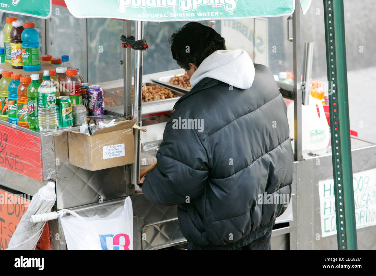 street vendor selling roasted nuts preparing stall on street corner new