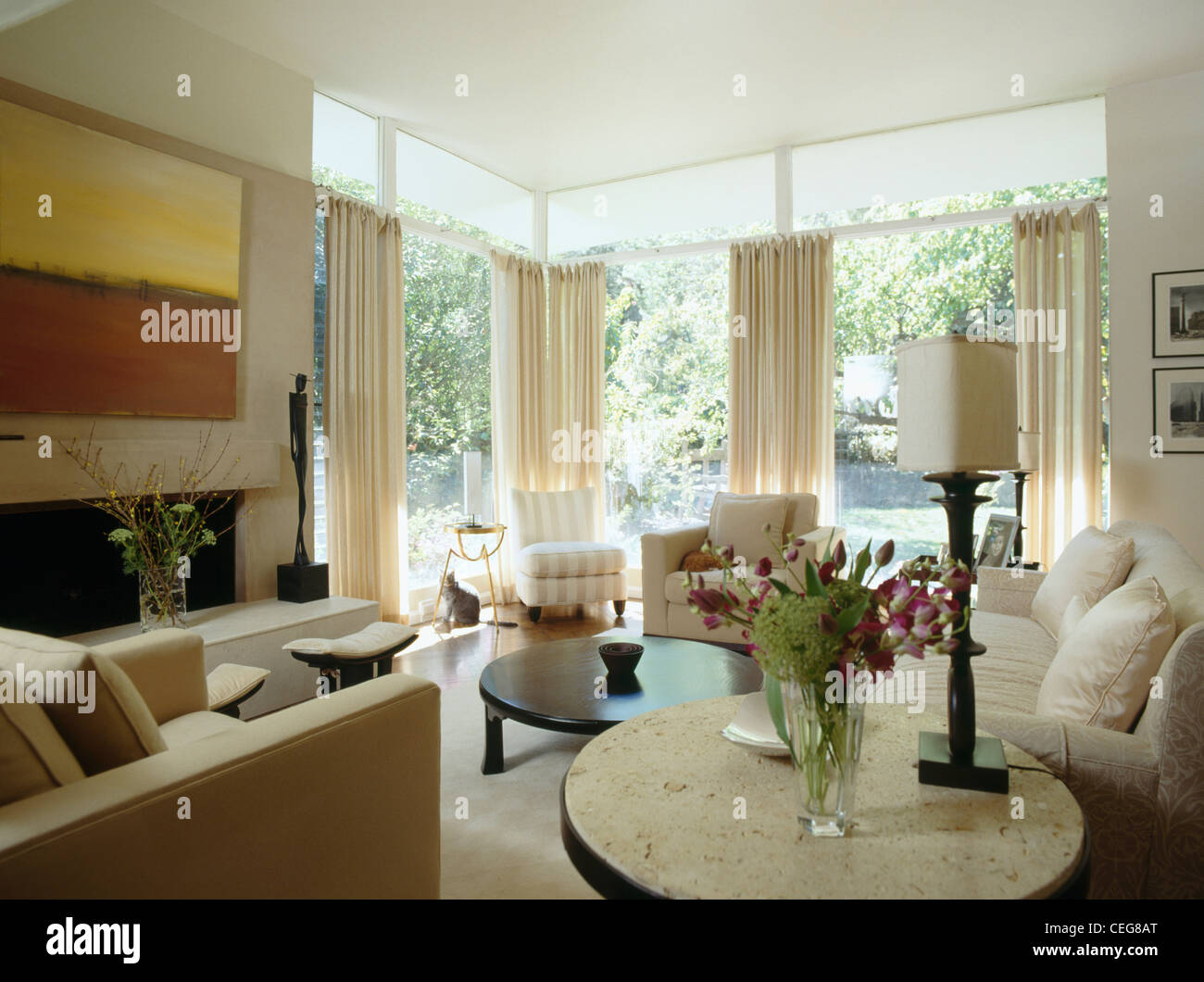 Cream Drapes On Large Windows In Modern Neutral Living Room With