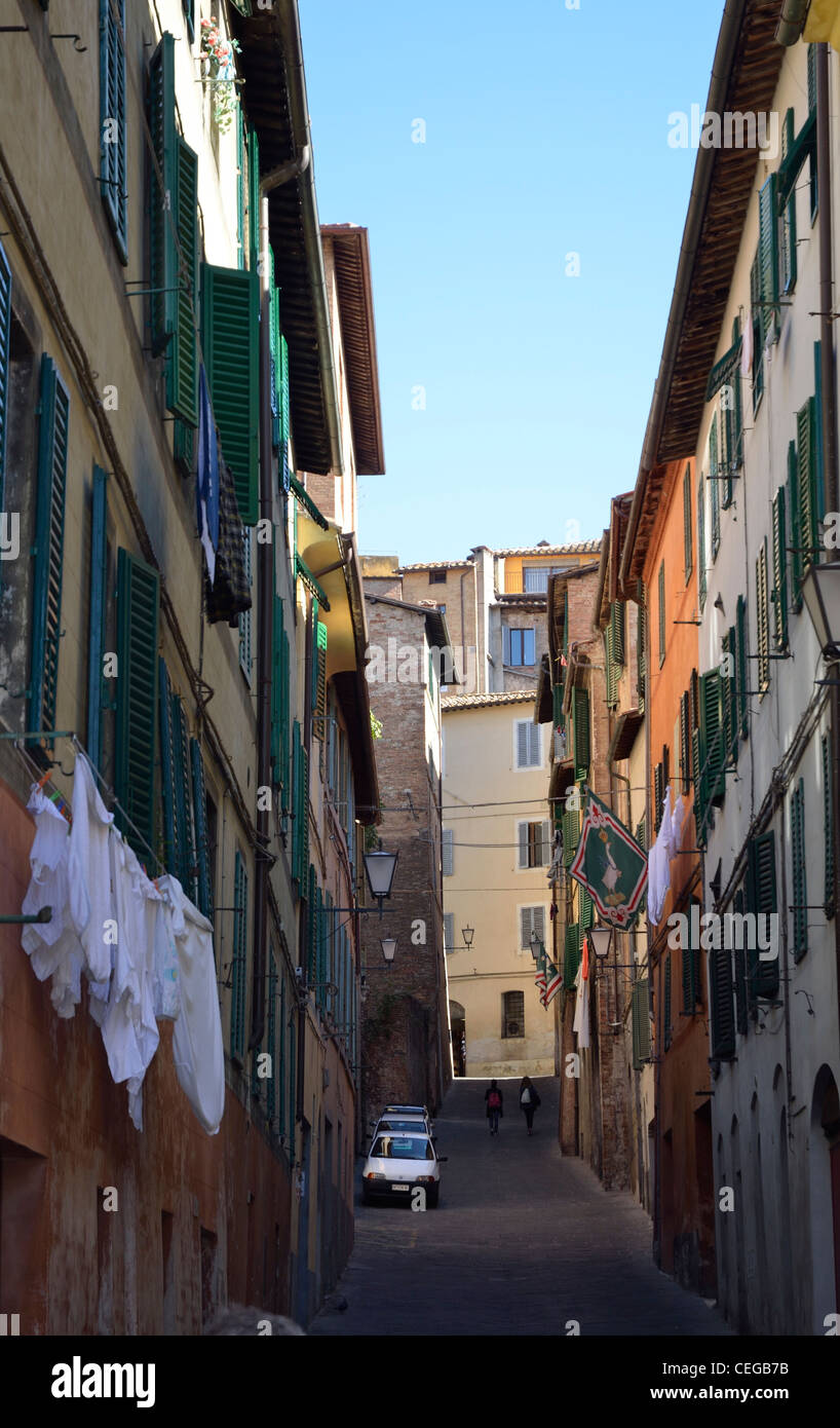 Narrow street, houses, washing hanging, Via Dei Pittori, Siena,Tuscany, Italy Stock Photo