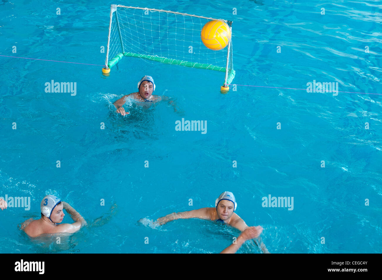 Amateur waterpolo match at the local swimming pool Stock Photo