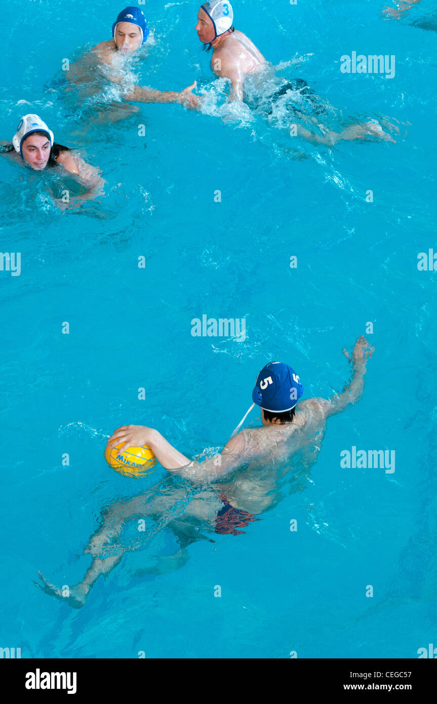Amateur waterpolo match at the local swimming pool Stock Photo
