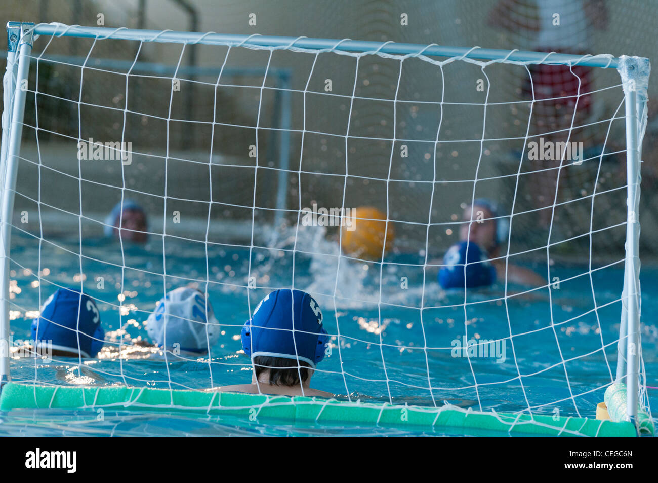 Amateur waterpolo match at the local swimming pool Stock Photo