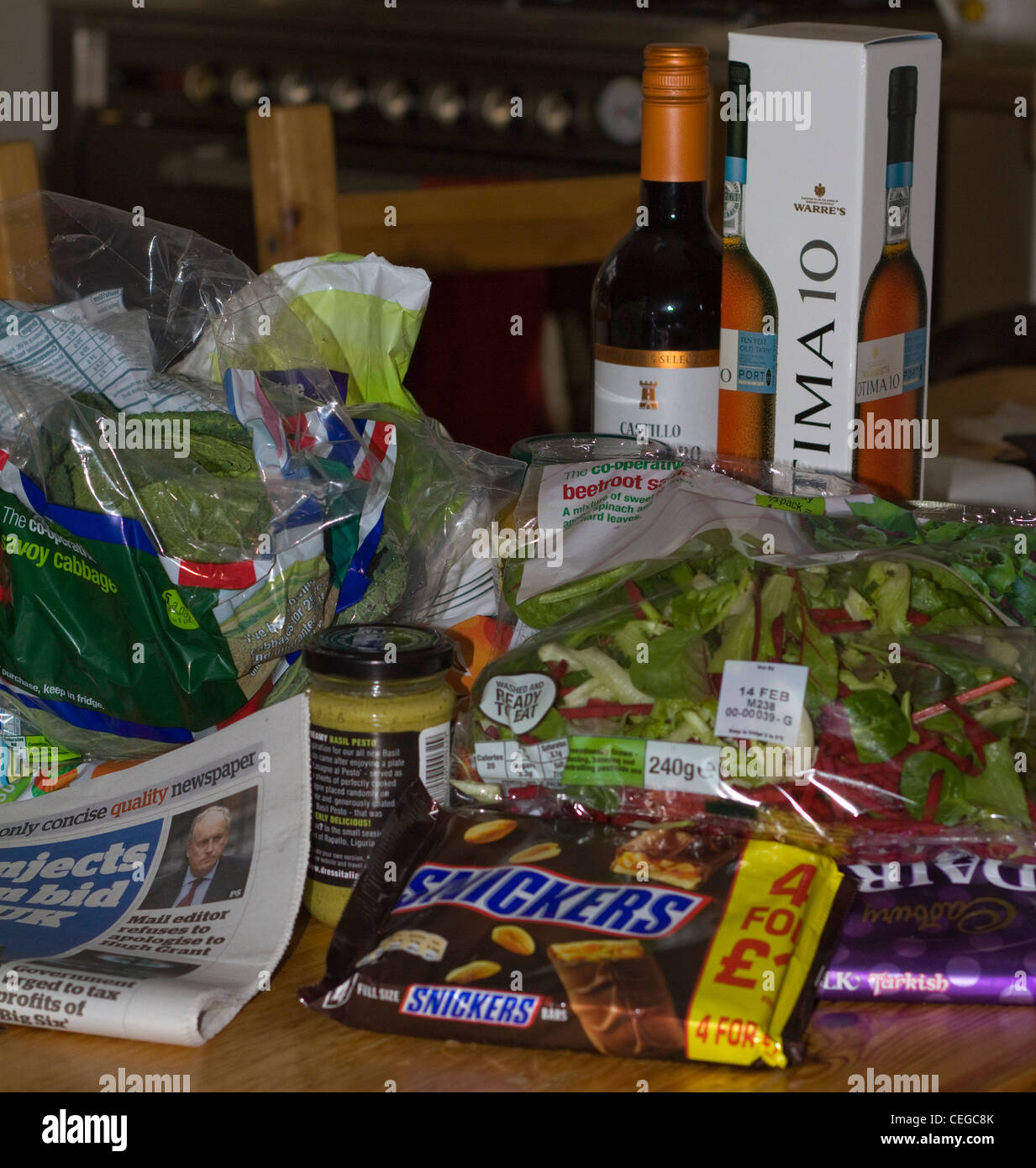 A pile of grocery shopping on a kitchen table Stock Photo Alamy