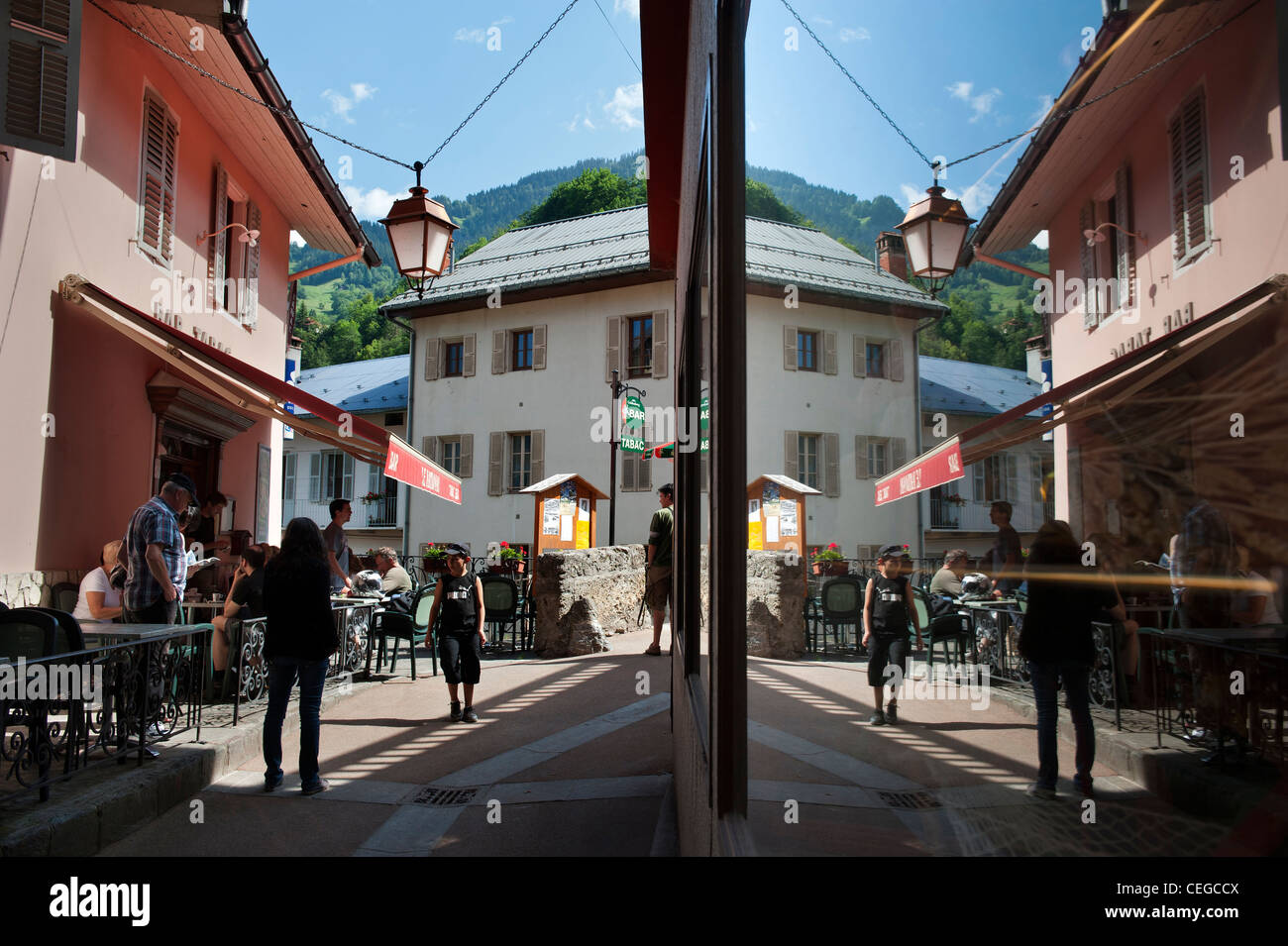 Shop reflected view of Beaufort village Savoie department in the Rhône-Alpes region in south-eastern France. Stock Photo