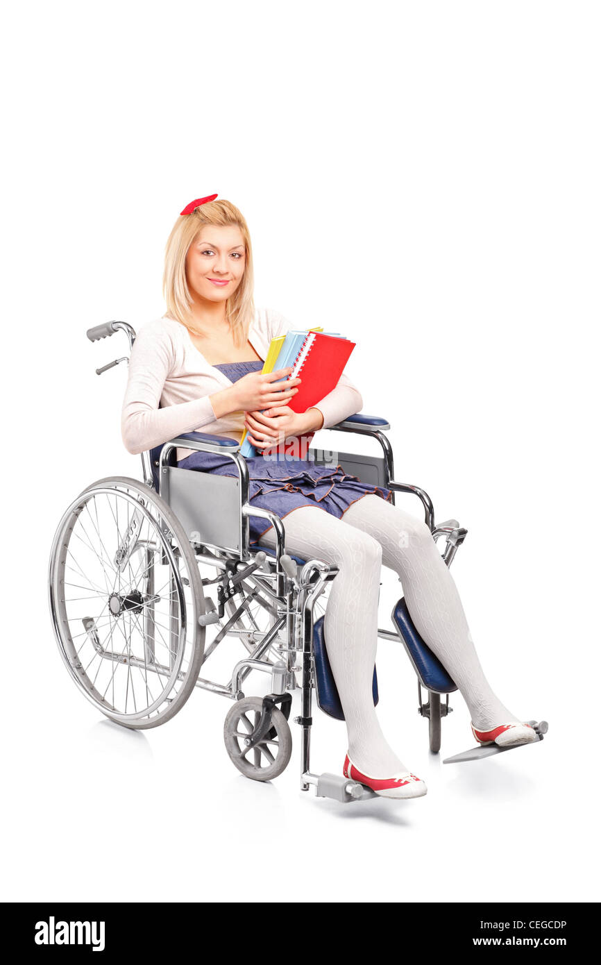 A smiling young girl in a wheelchair isolated on white background Stock ...