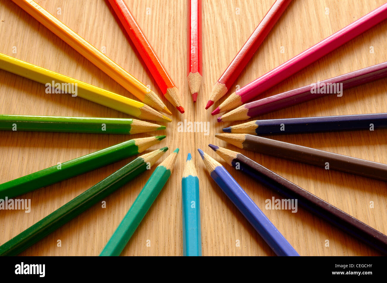 Beautiful colored pencils on a wood texture Stock Photo - Alamy