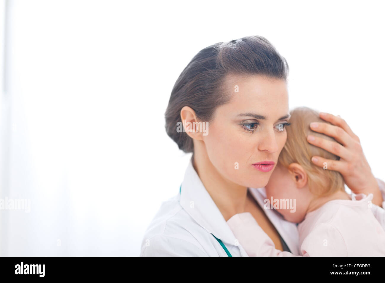 Pediatric Doctor Calming Baby Stock Photo - Alamy