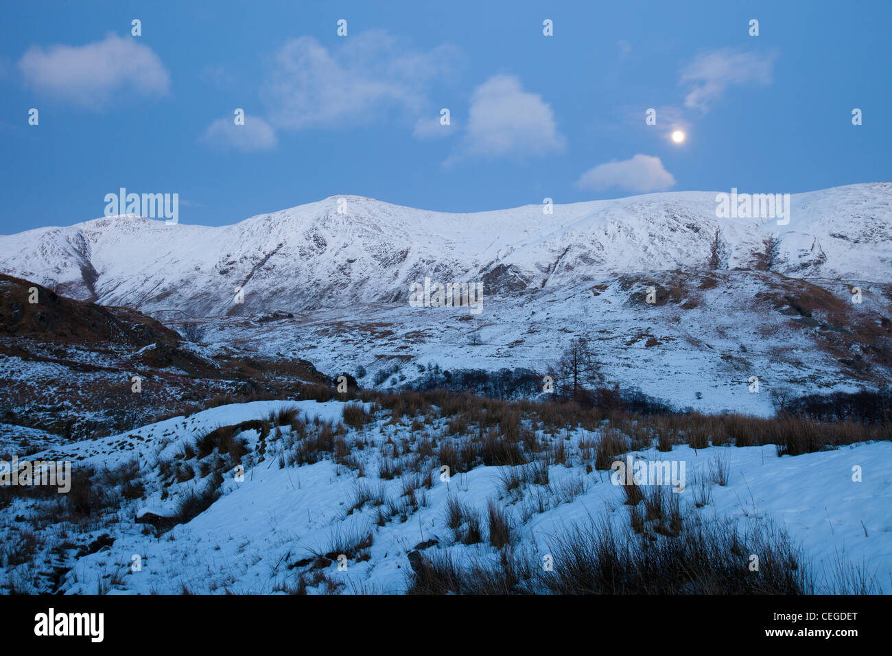 A full moon over the Kentmere Fells in the Lake District from Kirkstone Pass, UK. Stock Photo