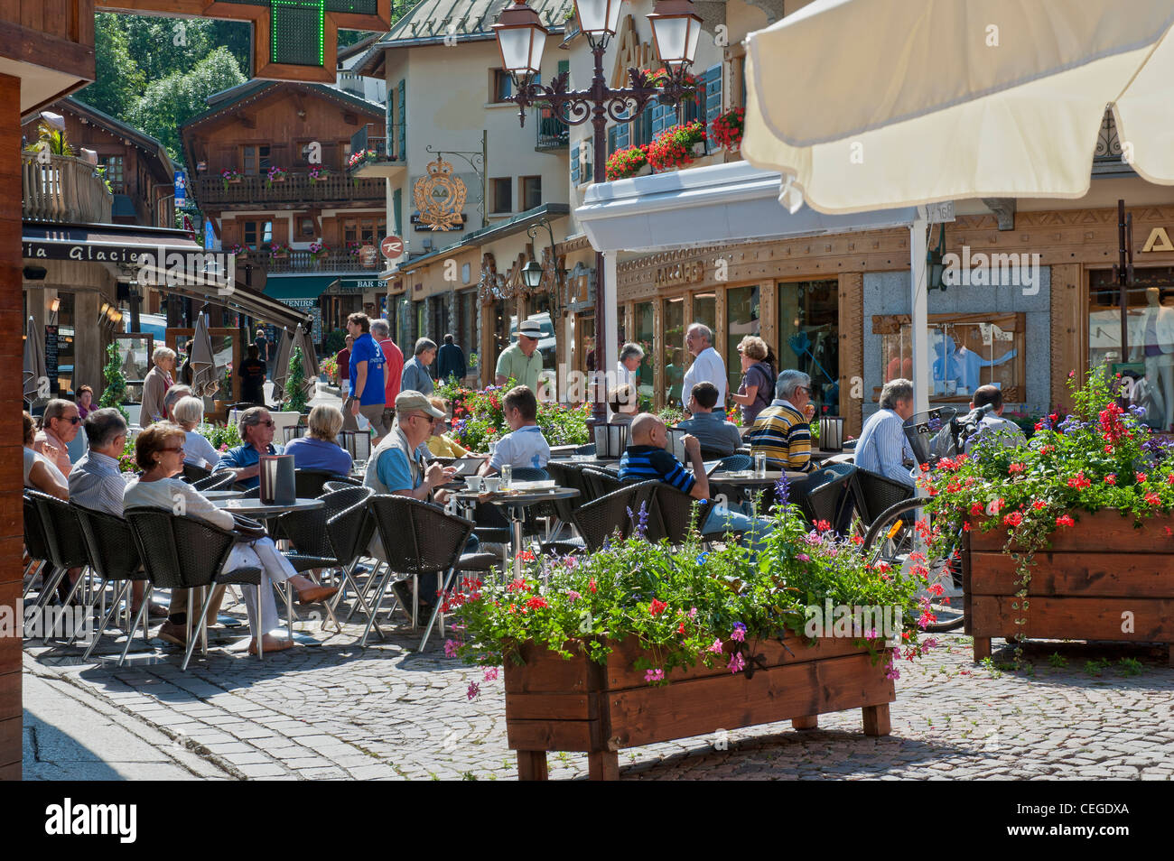 Street cafe in Megève village. Haute-Savoie department in the Auvergne-Rhône-Alpes region in south-eastern France Stock Photo