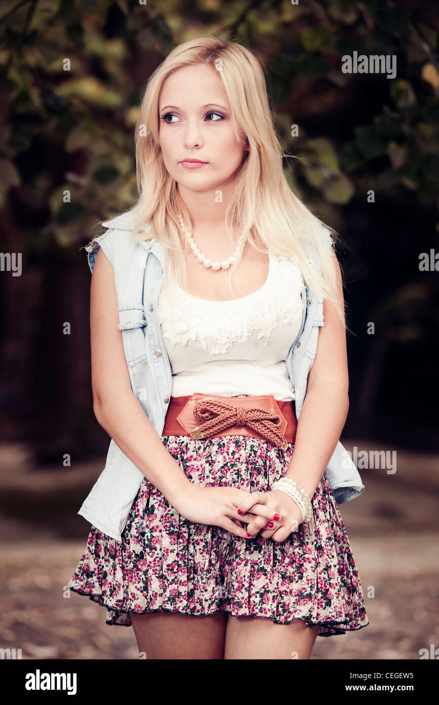 Outdoor portrait of a beautiful young woman in the park Stock Photo - Alamy