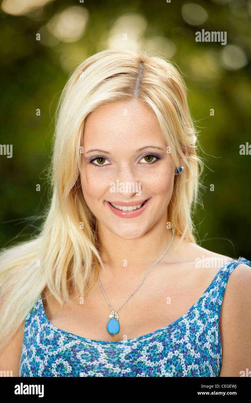 Outdoor portrait of a beautiful young girl smiling Stock Photo - Alamy